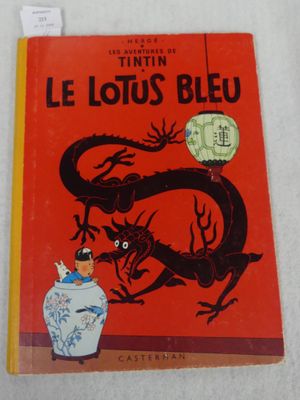 the cover of the book le lotus bleu is red with a dragon on it
