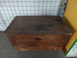 an old wooden chest sitting on the floor