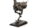 statue of an ostrich on a wooden base on a white background