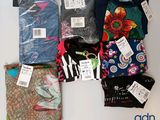 a lot of clothes that are on the table
