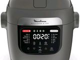 an image of a digital pressure cooker sitting on a white surface