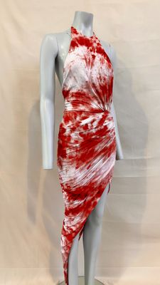the mannequin is wearing a red and white tie dye dress