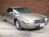 a picture of a silver car parked in a parking lot