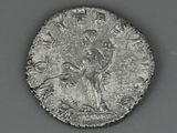 an old silver coin with a bird on top of it