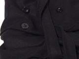 an image of a black shirt with buttons on it