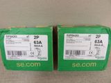 two green boxes with white labels on them sitting on a table