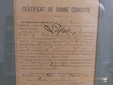 a certificate on display in a glass case