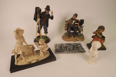 many figurines that are sitting on a table