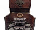 a small wooden box with a lock on it
