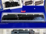 a box with a train set inside of it