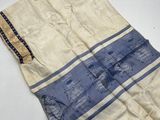 a close up of a towel on a white surface with a blue stripe