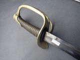 a close up of a sword with a handle on it