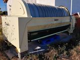 a large machine that is sitting in the grass