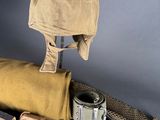 a hat, belt, and other items on a table