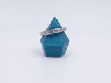 a ring that is sitting on top of a blue object