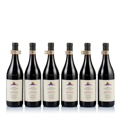 six bottles of red wine lined up in a row