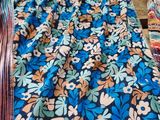 a close up of a pile of fabric on a wooden table