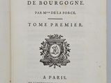 an open book with a black and white image of a clock on it