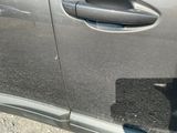 a close up of a car door handle with a sticker on it