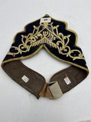 an image of a blue and gold hat on a white surface