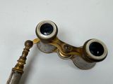 a close up of a pair of binoculars on a white surface