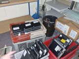 a man that is standing in front of a bunch of electronics