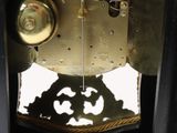 a clock that is in the middle of a black box