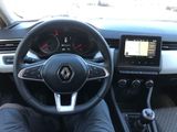 a picture of a person sitting in a car with a steering wheel