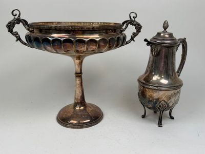 two silver vases and a silver teapot on a table