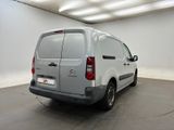 citroen van parked in a white room with a black floor