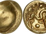 an image of a gold coin with a design on it