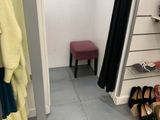 a closet with a lot of shoes on the floor
