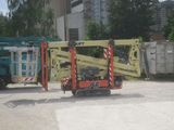 a crane that is sitting in the middle of a parking lot