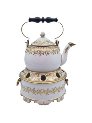 a white tea pot with a gold decoration on it