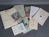 a lot of books that are sitting on a table