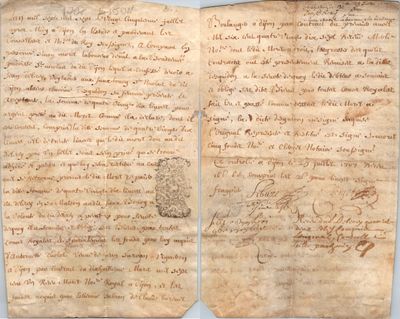 an old manuscript with writing on it sitting on top of a table