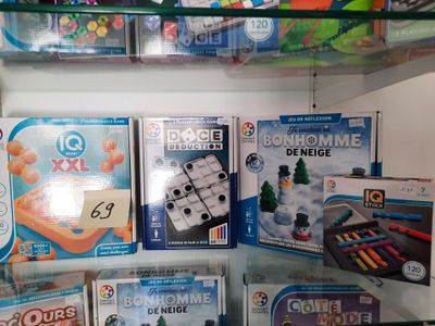 many toys and games on the shelves in the store