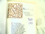 an open book with a picture of a saint on it