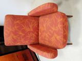 a chair that has a red and orange pattern on it