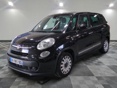 the black fiat fiorin is parked in a room with a checkered floor