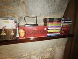 a shelf that has a lot of books on it