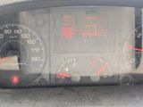 a car dashboard with a speedometer and gauges on it