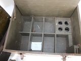 an old metal box with a bunch of compartments inside of it