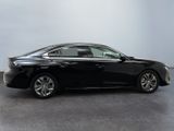 a picture of a black car parked in a showroom