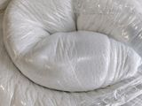 a picture of a white pillow wrapped in plastic