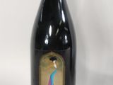 a bottle of wine that is sitting on a table