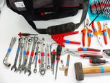 many tools that are laying out on a table