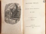 an open book with a picture of a man on top of a building