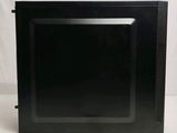 a black television sitting on a white surface