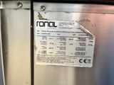 a label on the side of a stainless steel refrigerator